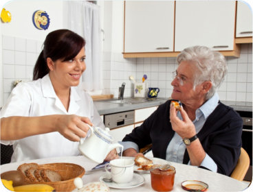 senior woman talking with caregiver